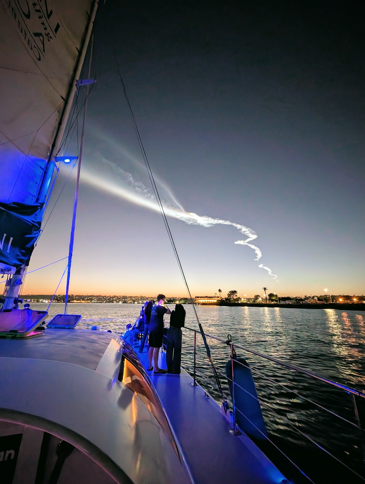 AOLANI catamaran lit blue at night